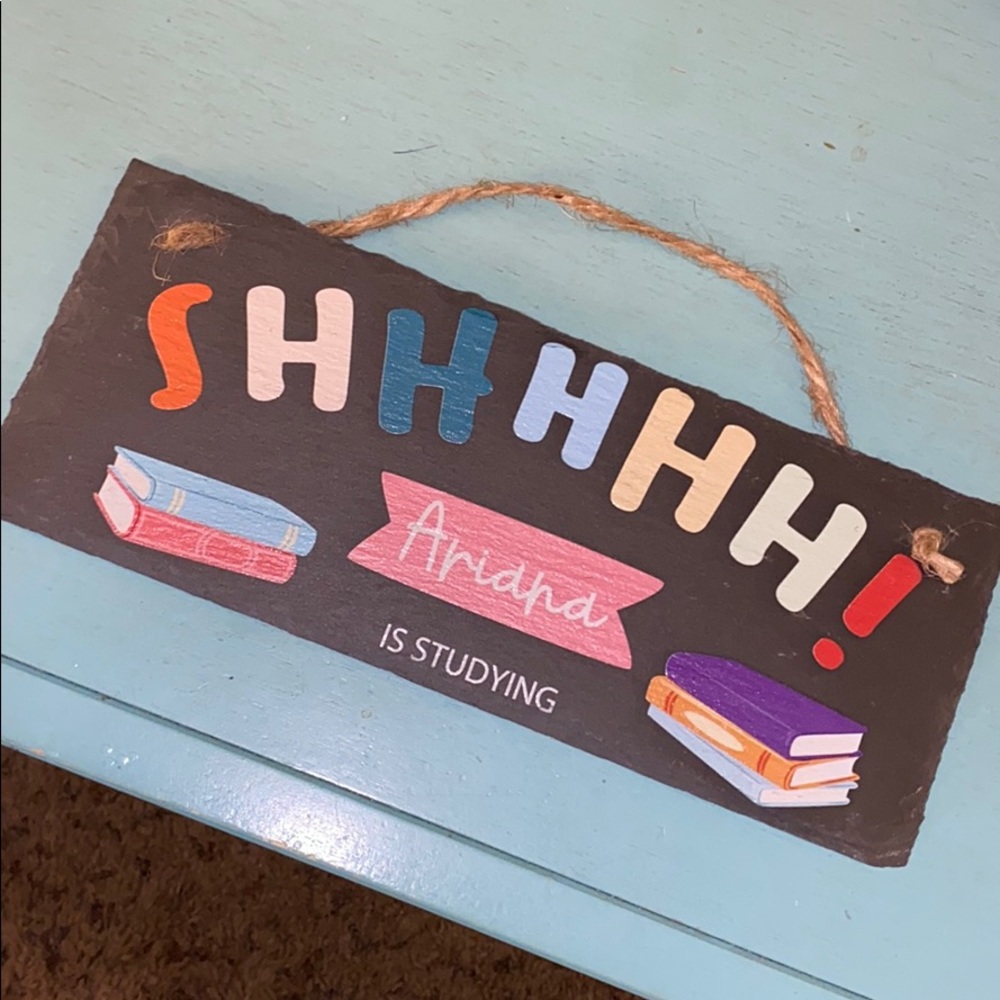 Slate sign “shhhh Ariana is studying”